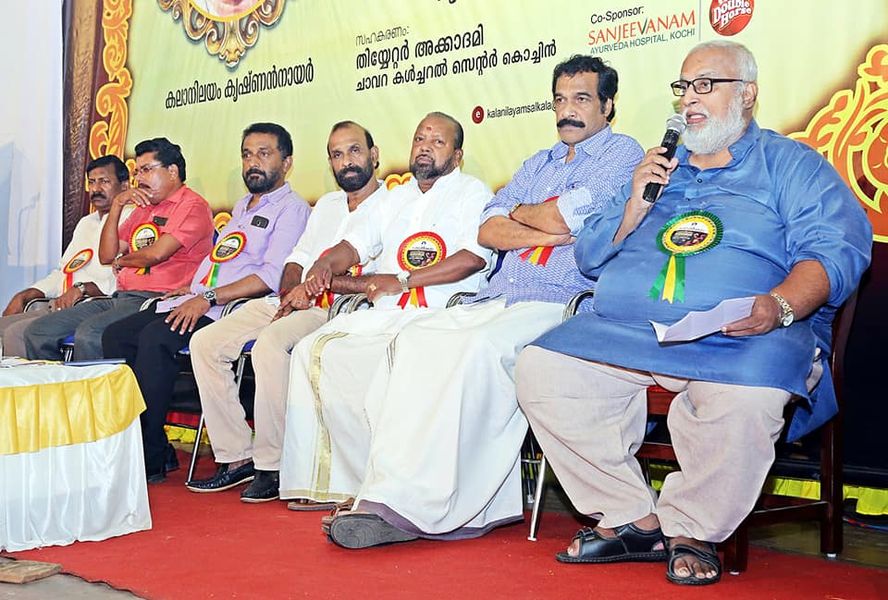 Speaker addressing the audience at a festival event